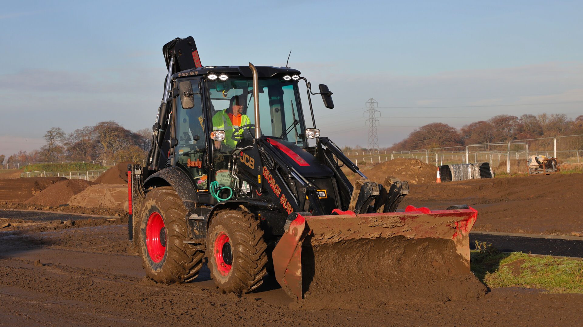 GBSS Civils and Plant Hire Black Backhoe Loader
