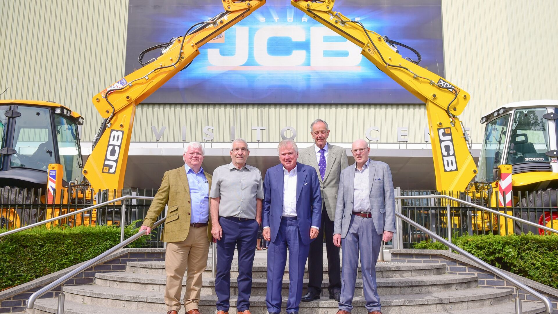 Lord Bamford with JCB's first ever apprentices