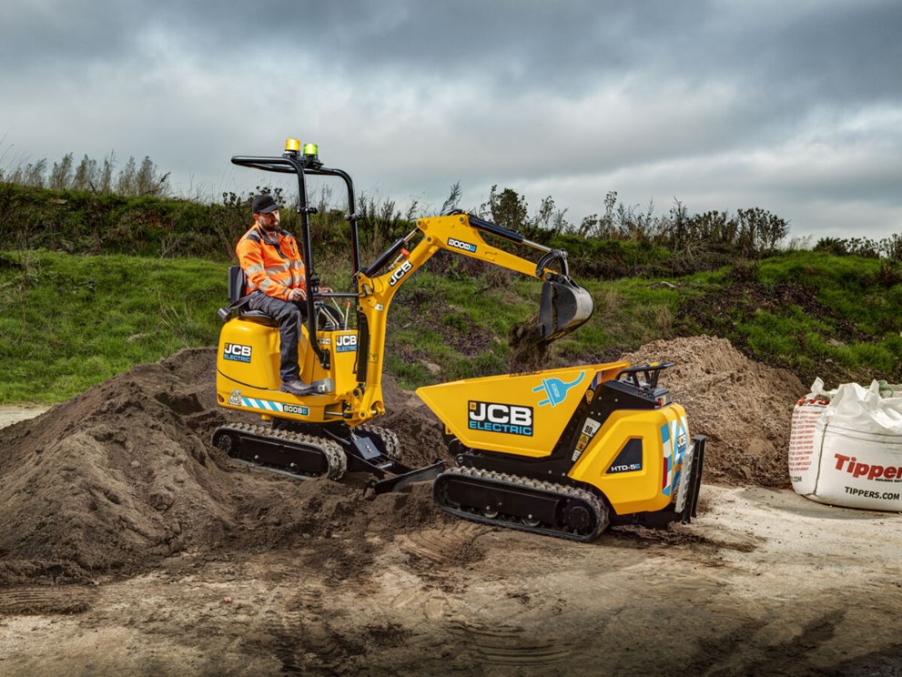 JCB 8008E micro excavator digging soil and loading it into a JCB HTD-5E dumpster. 